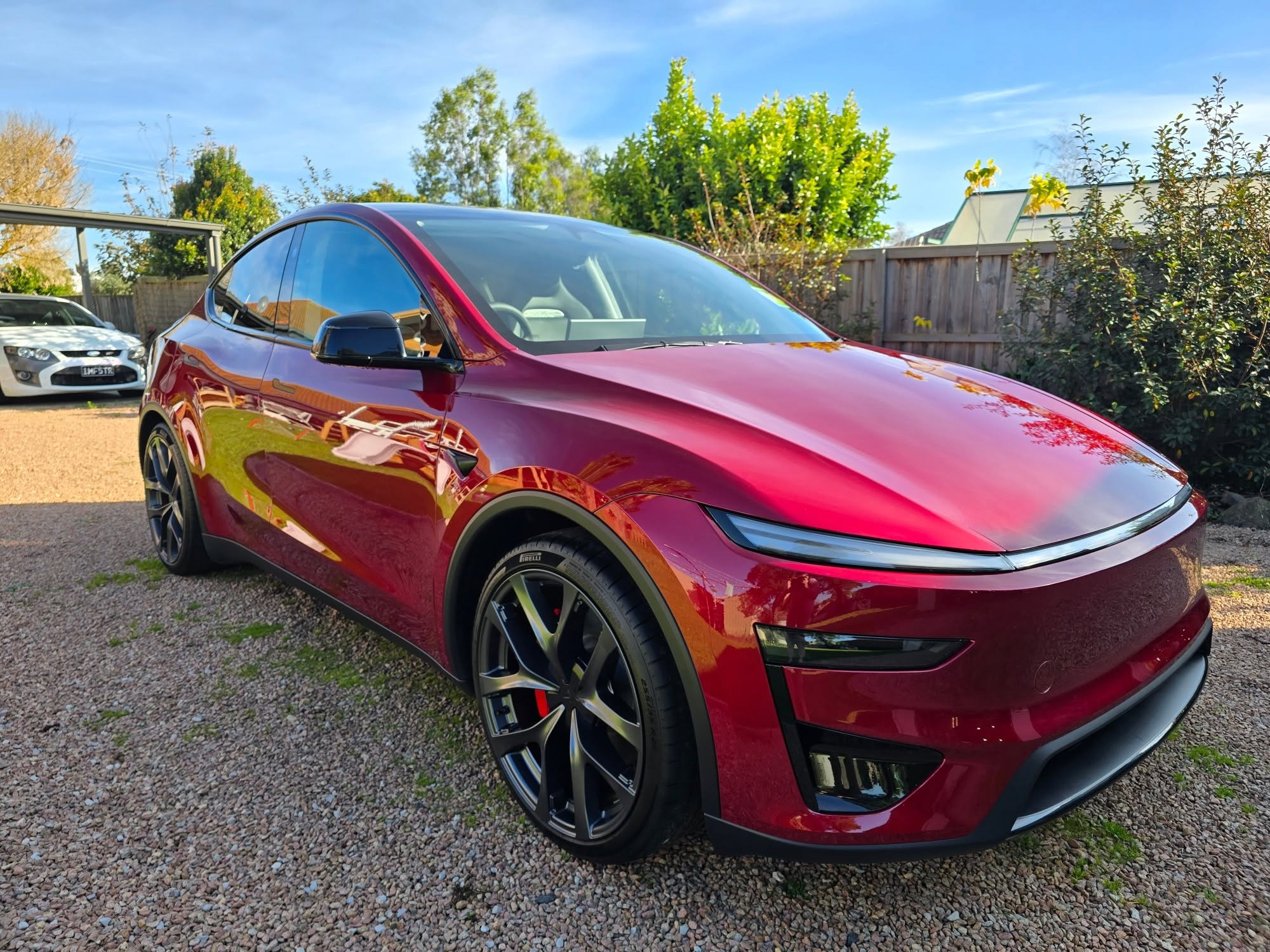 Red Tesla Model Y outdoors